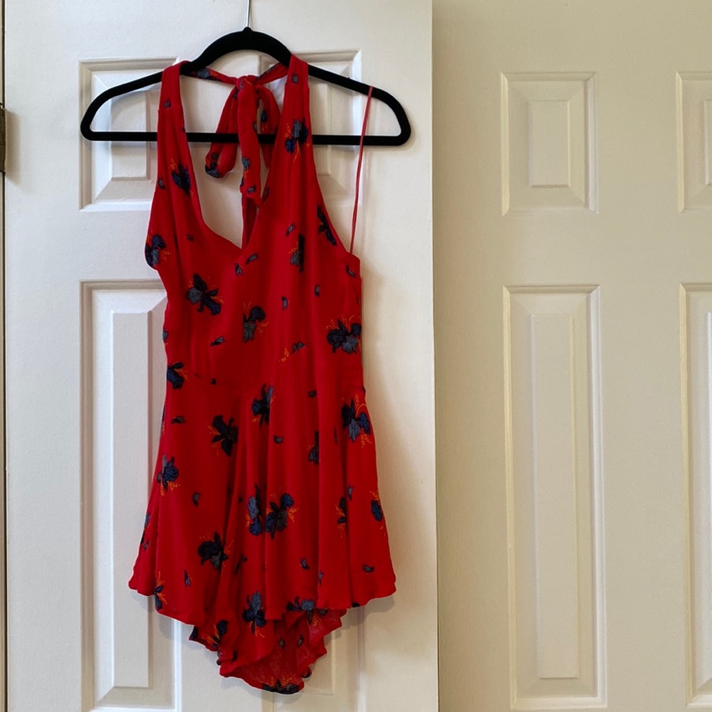 Free people romper with pockets and open tie back